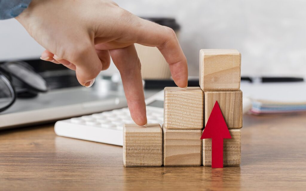 hand-climbing-wooden-blocks-represent-growth