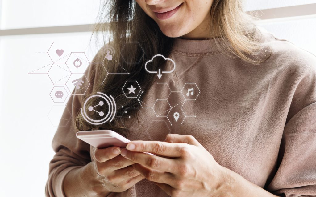 Smiling woman texting on her phone